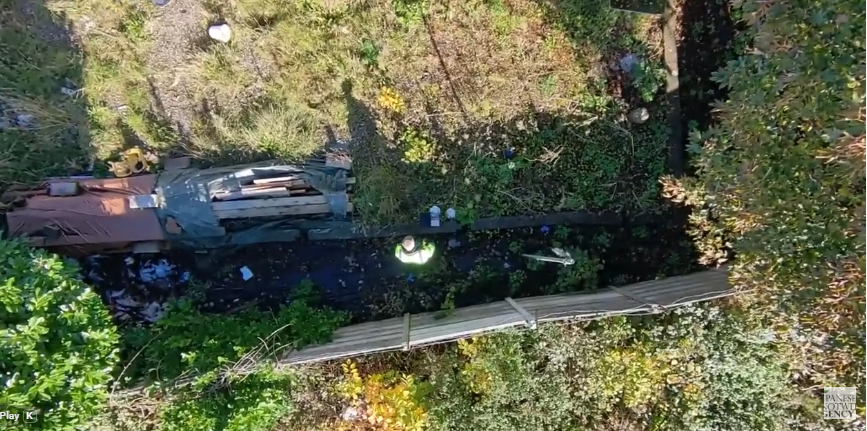 Aerial view of the Scout Hut site in Swinton showing the approximate alignment of the JKWA vertical Japanese knotweed barrier along the boundary with the adjoining railway embankment